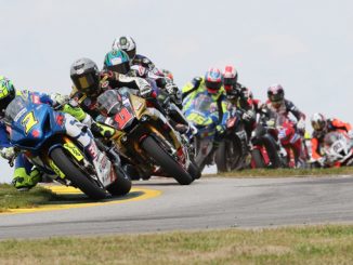 Toni Elias (1) leads Mathew Scholtz (11), Cameron Beaubier (hidden) and the rest of the Motul Superbike pack on Saturday at Road Atlanta on the opening lap