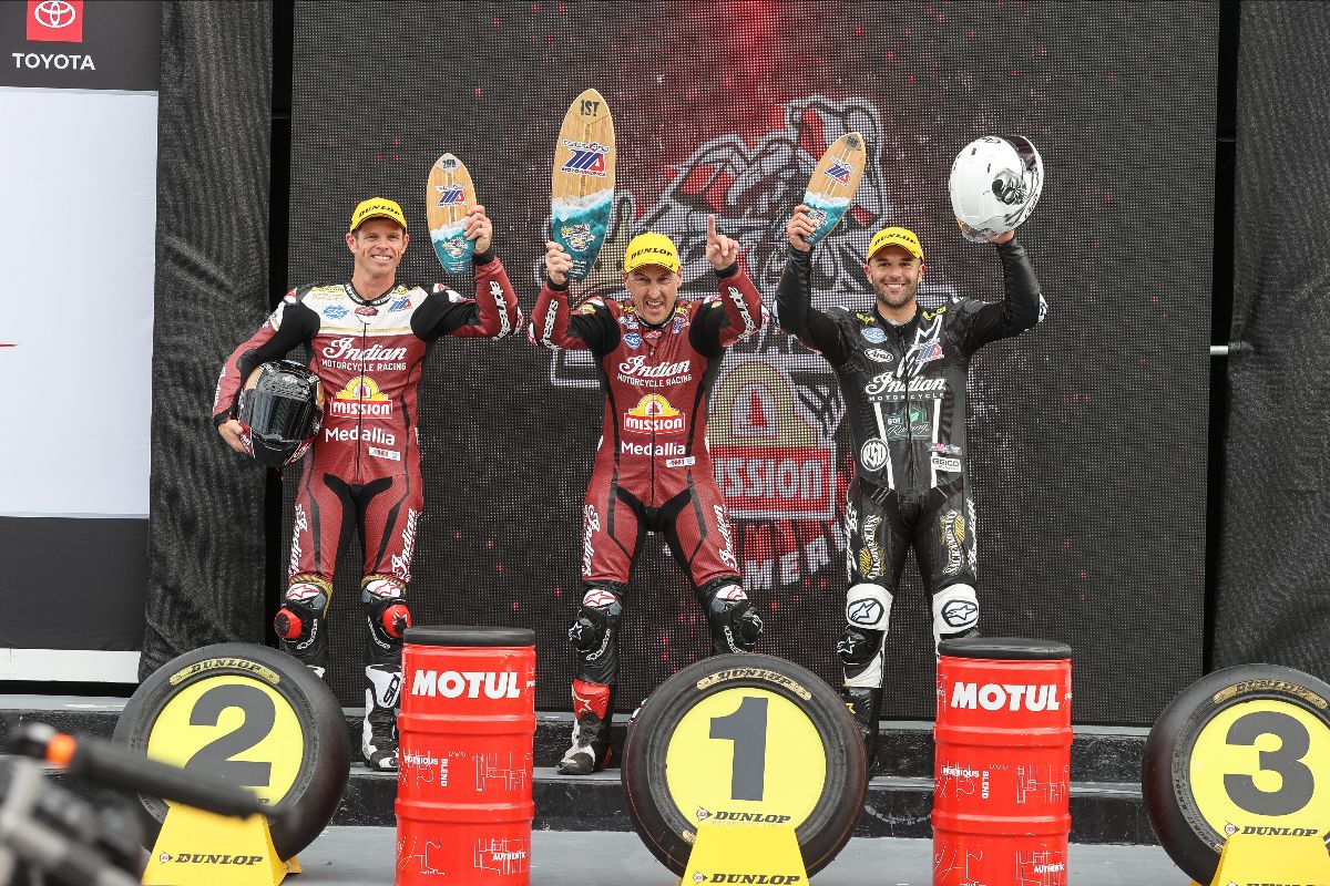 220313 McWilliams (center) is flanked by O'Hara (left) and Fong (right) in Victory Lane.