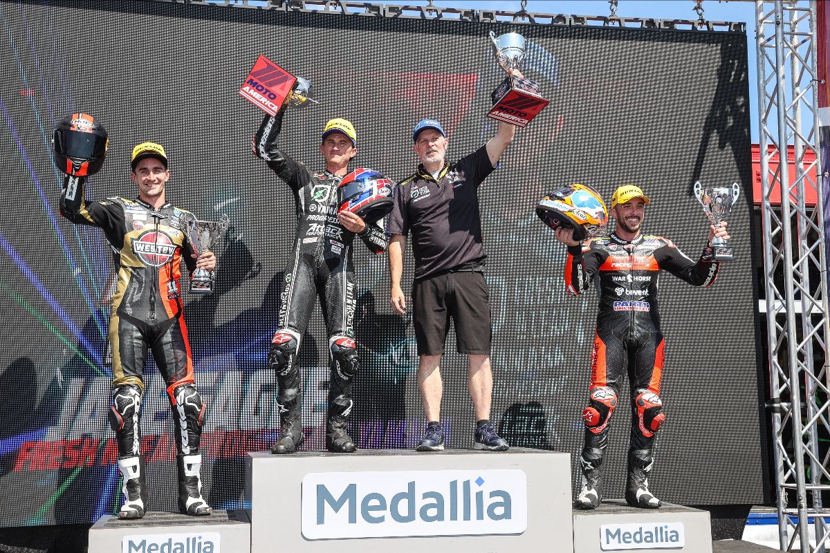 (Left to right) Mathew Scholtz, Jake Gagne, Walker Jemison and Josh Herrin celebrate on the Ridge Motorsports podium