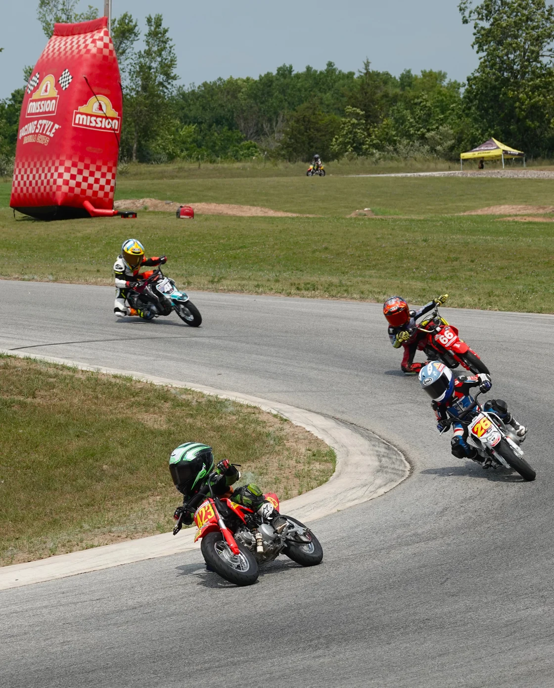 Cooper Jazikoff (423) leads Cruise Texter (26), Marcus Su (66), and Chip Lampley (41) early in the first Stock 50 class